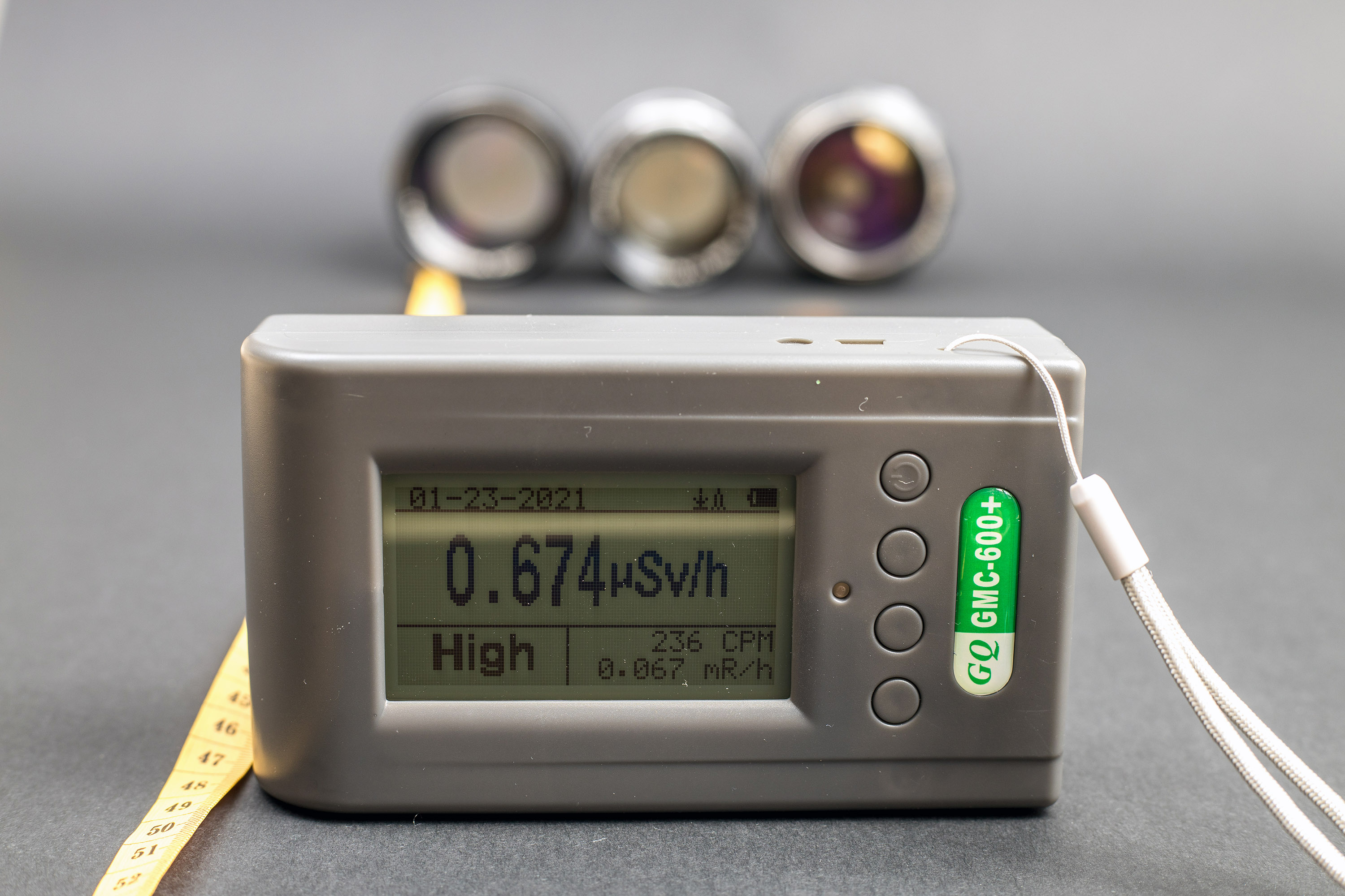 At a distance of about 45 cm from three radioactive lenses pointing at detector we get 0.7 uSv/h