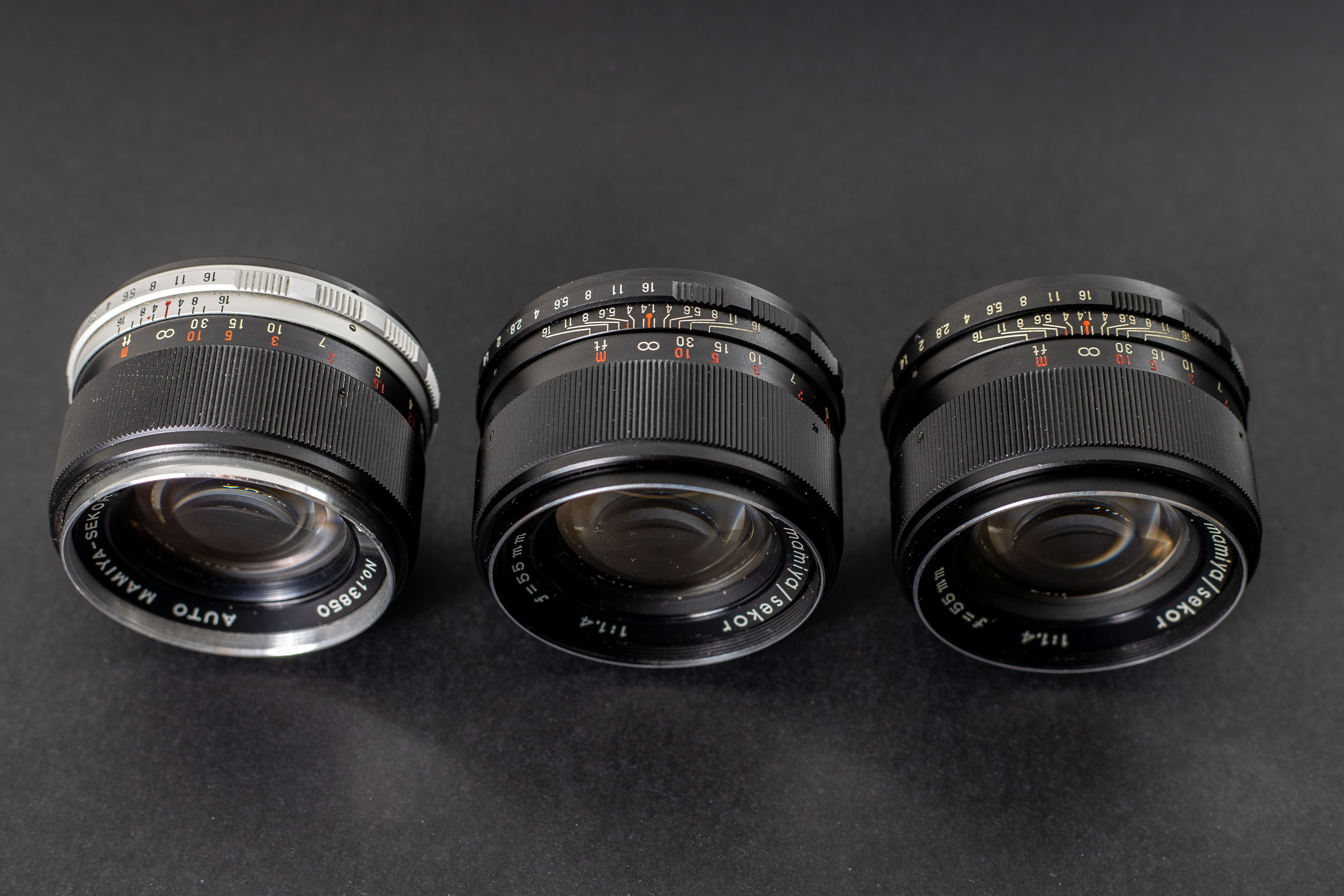 Three Mamiya Sekor 55mm f1.4 lenses - Angle view