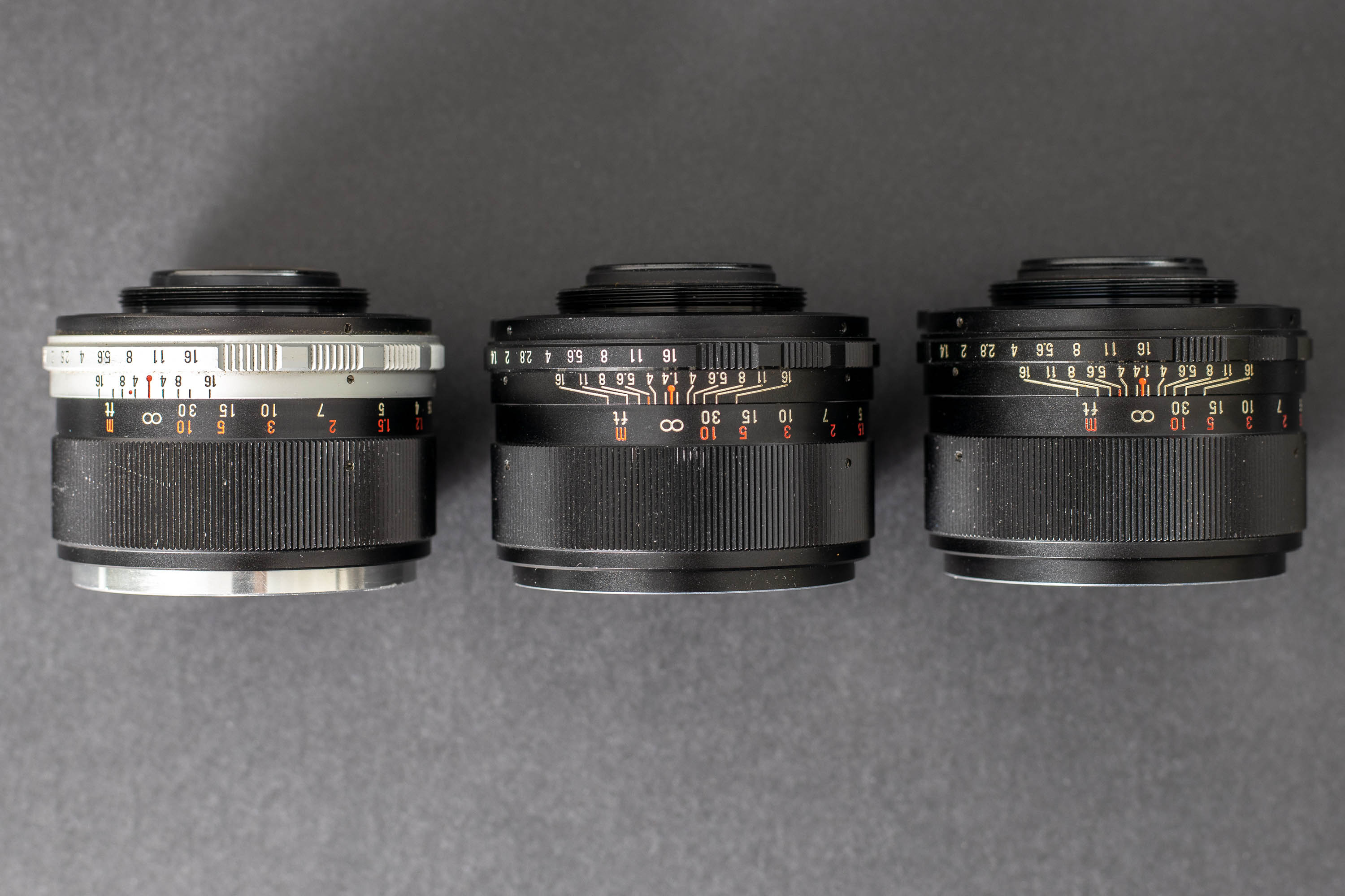Three Mamiya Sekor 55mm f1.4 lenses - Side view