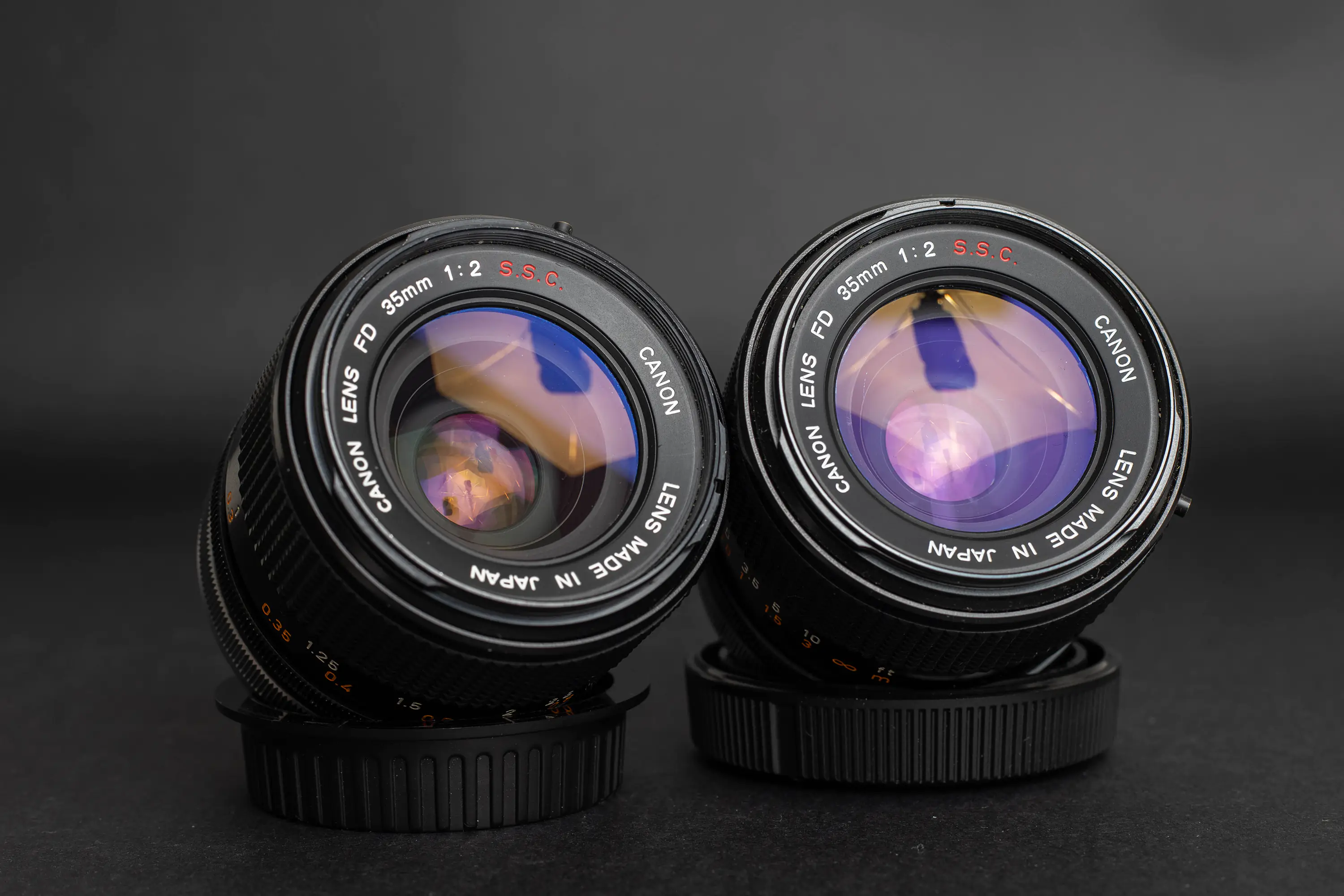 Two Canon FD 35mm f2 concave lenses of the first S.S.C. version.